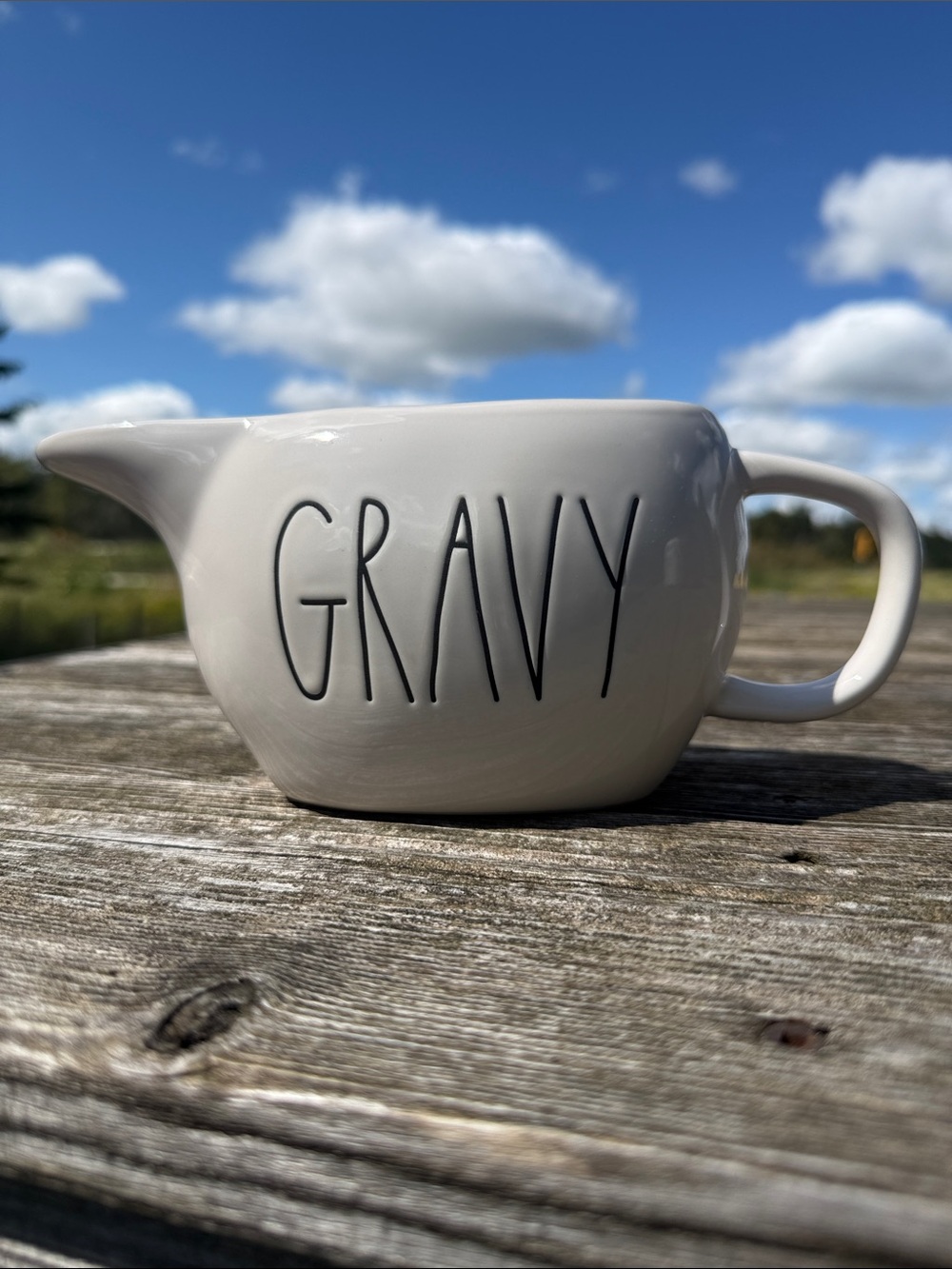Rae Dunn gravy bowl with orange interior